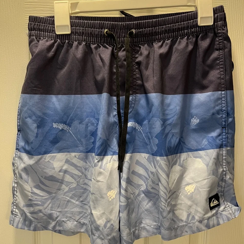 Men’s size medium blue striped floral Quiksilver swim trunks